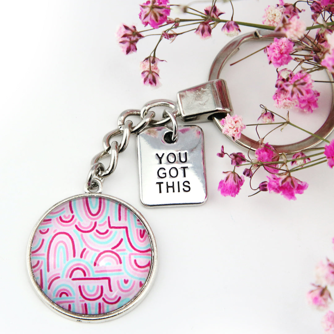 Pink rainbow print set in vintage dsilver keyring accessory with you got this charm. 