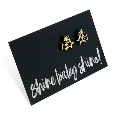 Star cluster gold earring studs on shine baby shine card.
