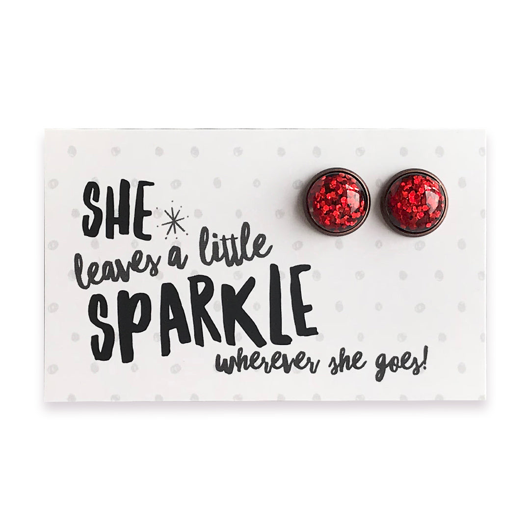 She leaves a little sparkle wherever she goes earring gift card with 12mm ruby red glitter earring studs with vintage copper circle surround.  