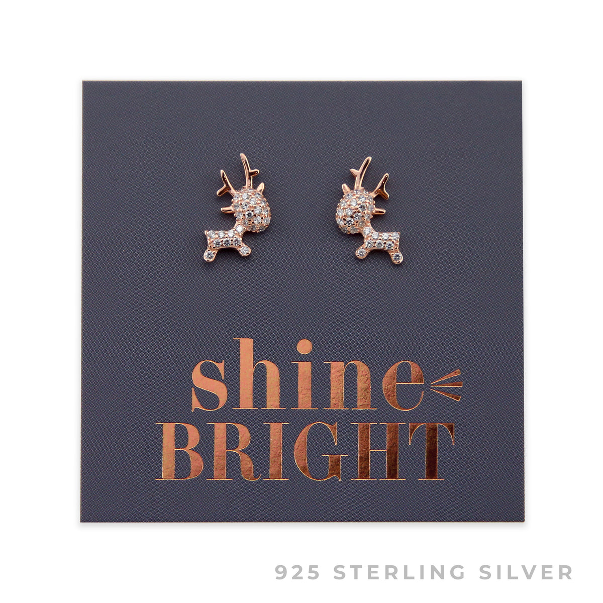 A pair of rose gold sterling silver reindeer stud earrings with cubic zirconia stones, presented on a dark background with 'shine bright' written in gold.