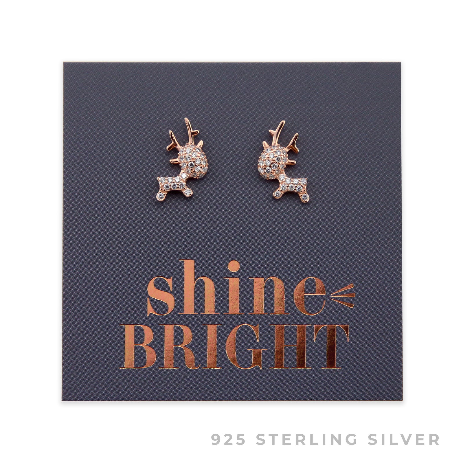 A pair of rose gold sterling silver reindeer stud earrings with cubic zirconia stones, presented on a dark background with 'shine bright' written in gold.
