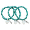 Turquoise stone bracelet with opalite stone heart charm and inspiring word charm.
