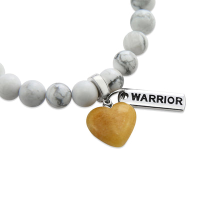 White howlite marble stone bead bracelet with charms featuring yellow adventurine heart.