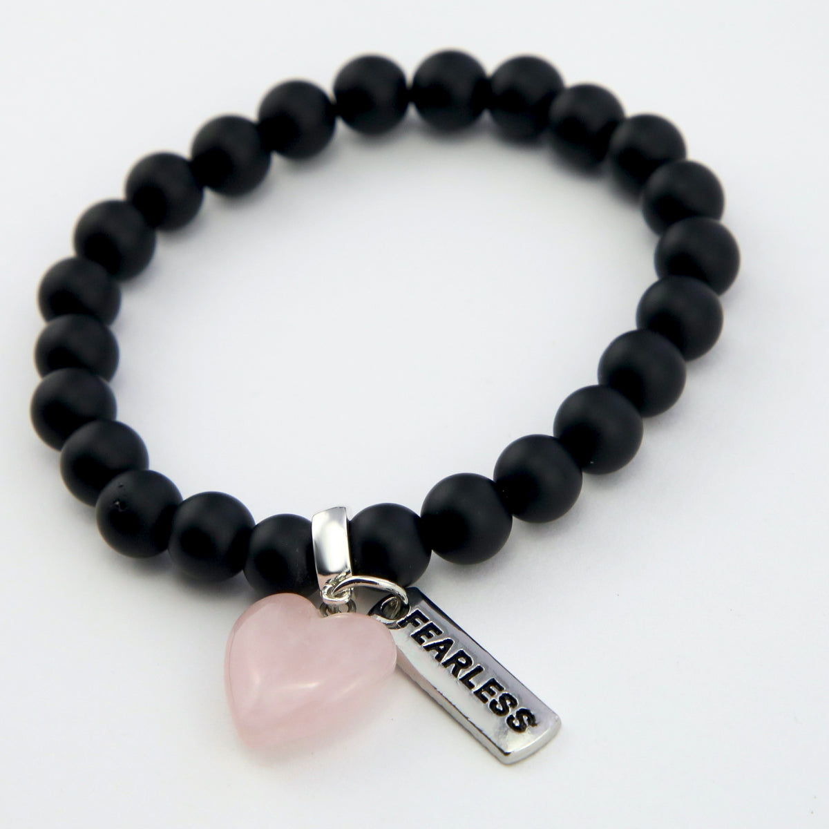 Matt black onyx stone bead bracelet with rose quart6z stone heart pendnat charm and silver inspiring word charms. 