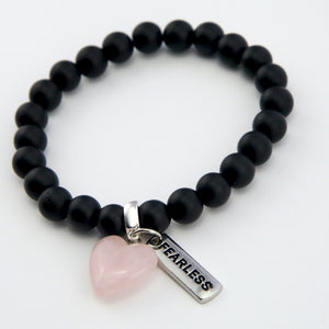 Matt black onyx stone bead bracelet with rose quart6z stone heart pendnat charm and silver inspiring word charms. 
