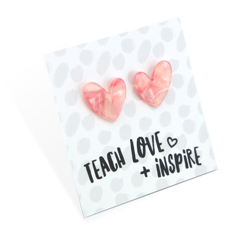Pinky peach coloured resin heart earrings on Teach, Love Inspire card. 