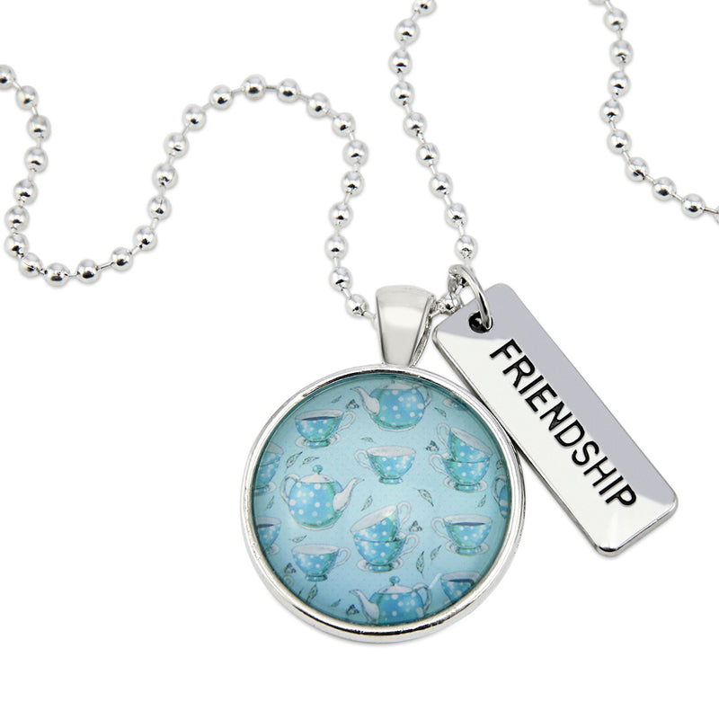 Teal tea cup print pendant necklace in bright silver with friendship charm. 
