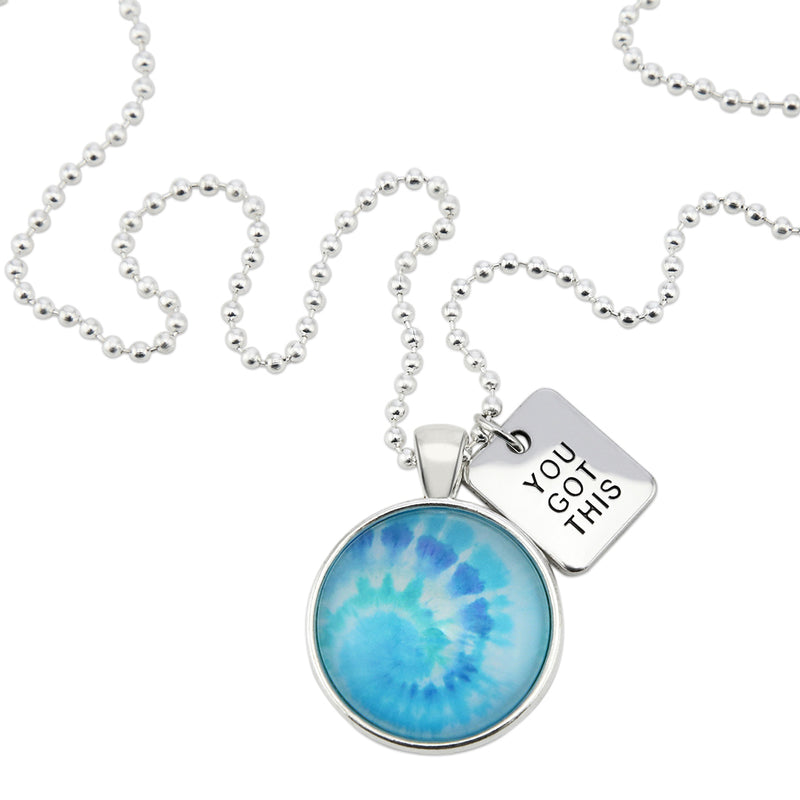 Teal tie dye print pendant necklace in bright silver with you got this charm. 