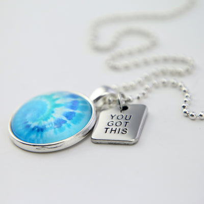 Teal tie dye print pendant necklace in bright silver with you got this charm.