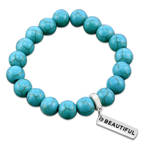 Turquoise stone bead bracelet with silver charms with meaningful words. 