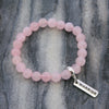 Rose Quartz 8mm stone bracelet with silver warrior word charm and clip.