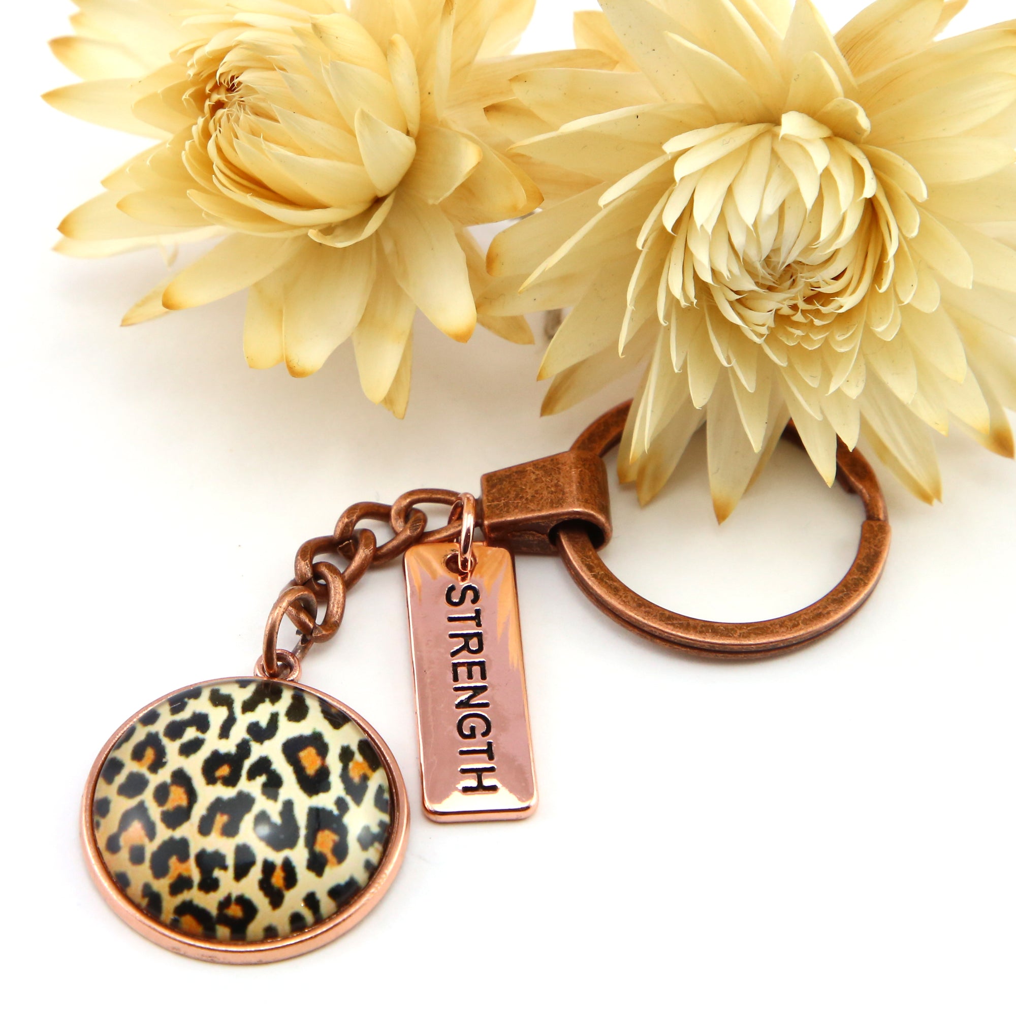 Leopard print keyring set in rose gold with strength charm 