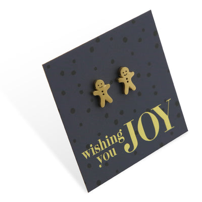 Gold stainless steel gingerbread cookies on foil wishing you joy card.