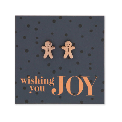 Rose gold stainless steel gingerbread cookies on foil wishing you joy card.